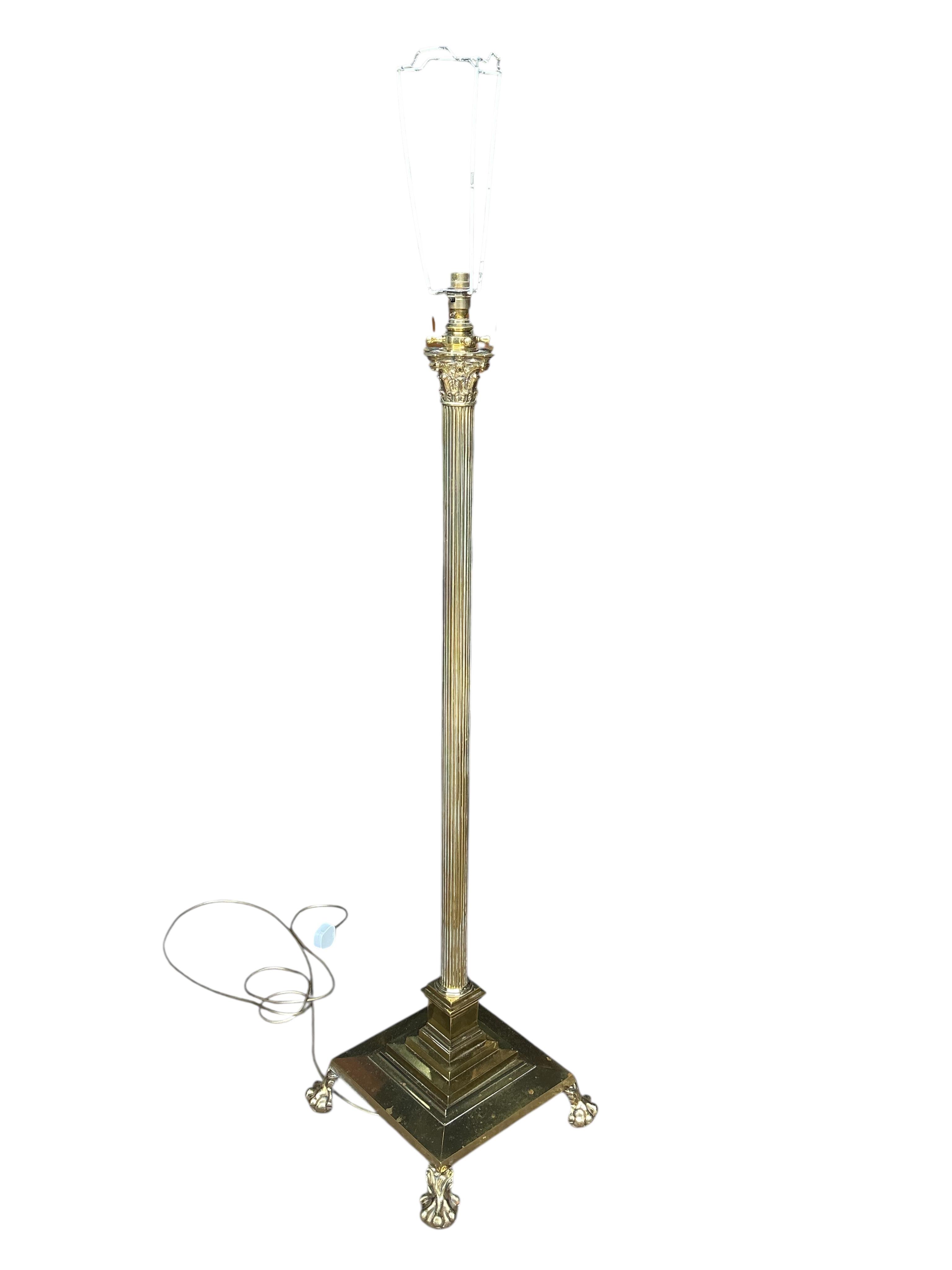 An Edwardian brass Corinthian column telescopic standard lamp